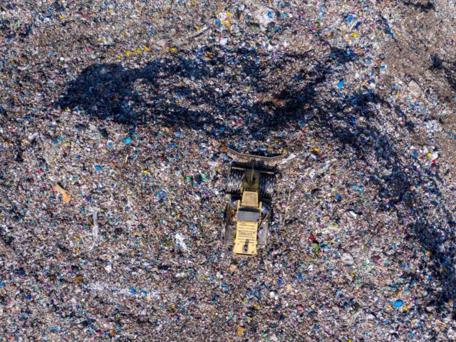 aerial-drone-view-of-bulldozer-working-on-landfill-AZHR6WE (1)